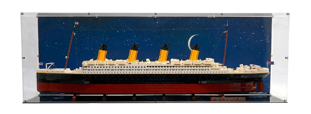 lego titanic in display case with nighttime background