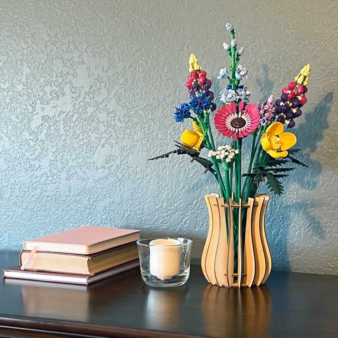 LEGO flowers in a birch vase on a table