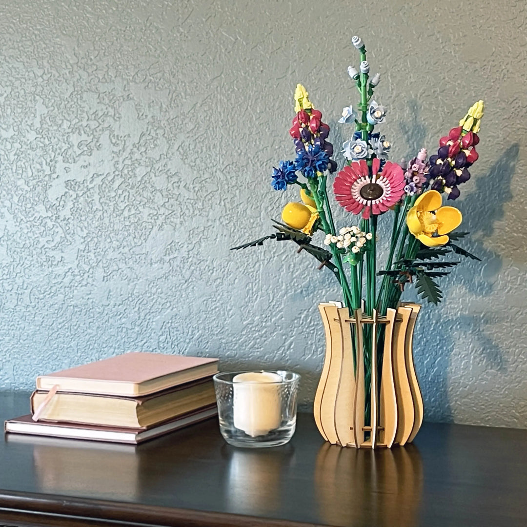 LEGO flowers in a birch vase on a table