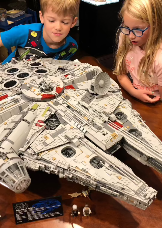 kids staring in awe at huge lego set