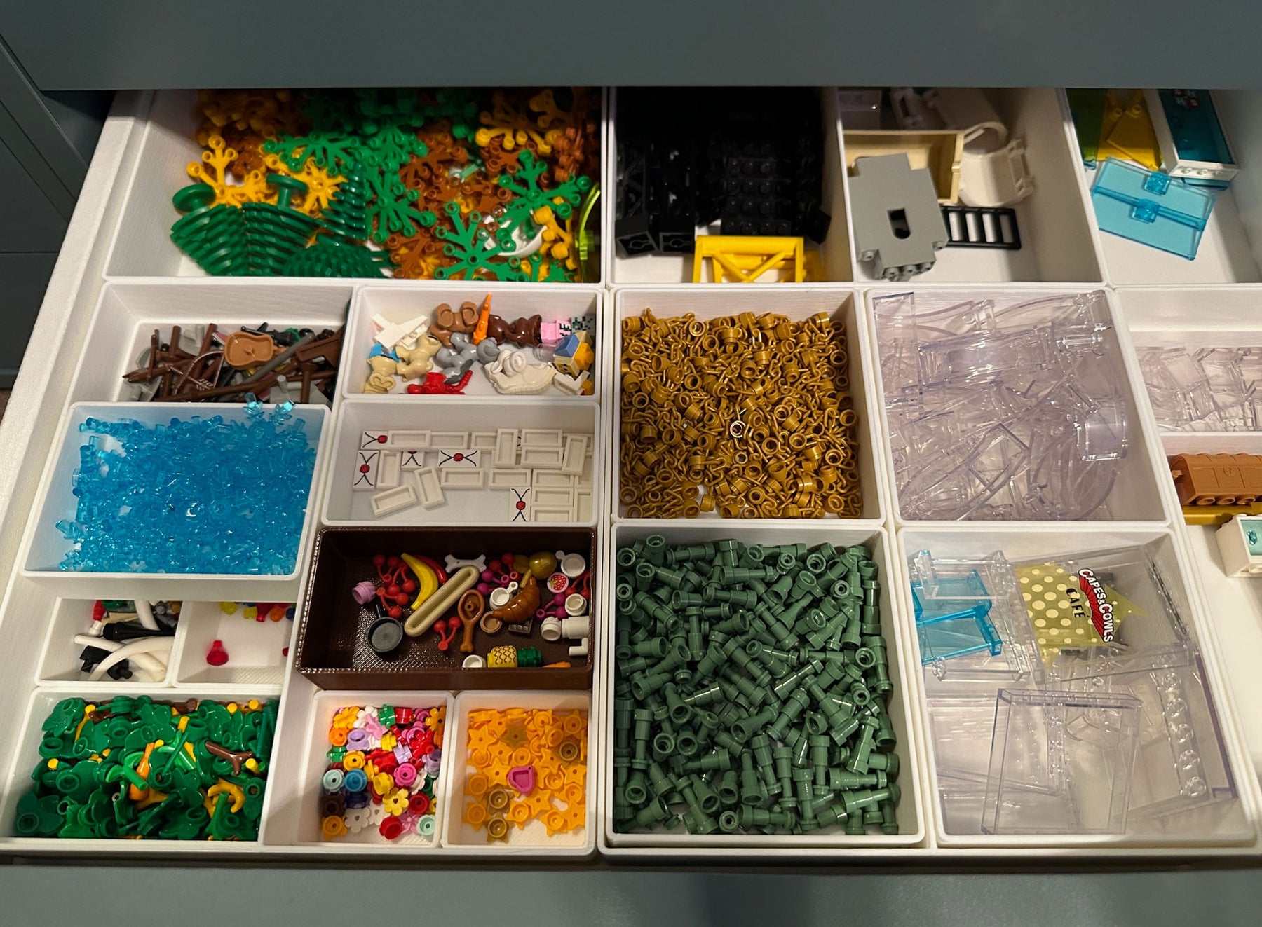 Lego uses these stacked Ikea Alex drawer units for parts storage -- any  idea what they use to attach the plates to the front? : r/LegoStorage