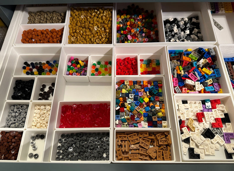 Lego uses these stacked Ikea Alex drawer units for parts storage -- any  idea what they use to attach the plates to the front? : r/LegoStorage